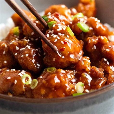 General tsao. While the chicken is cooking heat 1 tablespoon of oil in a large saucepan or skillet. Add in garlic and cook for 1 minute. Add in the sauce ingredients and simmer until thickened. Stir in the cooked chicken tossing to coat the chicken in the sauce. Simmer for 3-4 minutes to thicken. 