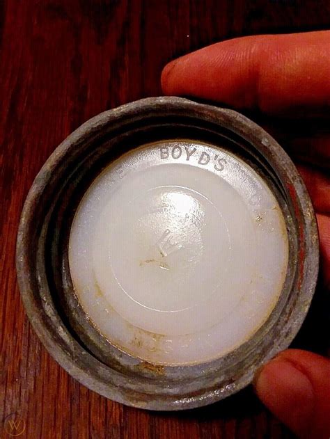 1) Boyd’s Genuine Porcelain Lined Cap [There may or may not be a mold number, such as 1, 2, 3, 7, 9, 13, etc, embossed in the center, or along the rim] 2) Genuine Boyd Cap / For Mason Jars. 3) [Diamond logo] Genuine Zinc Cap [Diamond Logo] For Ball Mason Jars. 4) Genuine Porcelain Lined Mason Cap. . 