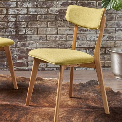 Nov 9, 2022 · With an overall measurement of 19.5 x 31.5 x 19.5 inches, the George Oliver Putnam Side Chair effortlessly fits in apartments, tight spaces, or anywhere you want a softer mid-century vibe. It combines a foam-padded upholstered seat and back for comfort and a rubberwood frame that can support up to 250 pounds. 