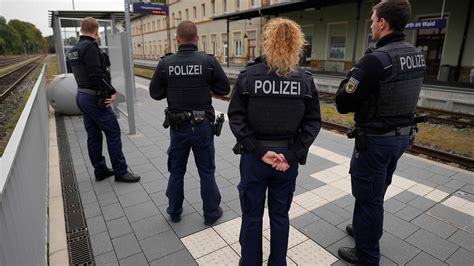 German police arrest two men accused of smuggling as many as 200 migrants into the European Union