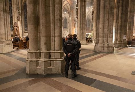 German police say they are holding a man in connection with a threat to Cologne Cathedral