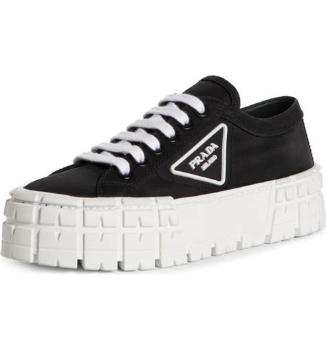 Get Sky-High Style with Platform Prada Sneakers