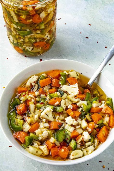 Giardinera recipe. Add enough cold water to cover the vegetables, then put a lid over the container and refrigerate for 12-24 hours. After soaking, drain and rinse the vegetables and set aside in the large mixing bowl. In a medium mixing bowl mix together all the ingredients for the dressing. 