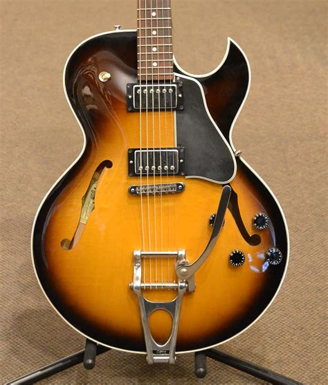 The Gibson ES-135 is a semi-hollow body electric guitar made by the Gibson Guitar Corporation. Originally introduced in 1956, it was discontinued in 1958. The model, with some modifications, was reintroduced in 1991 and remained in production until 2002, however at least one known example was given a 2003 production date. Serial: 94029745.. 