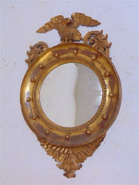 Gilt bulls eye mirror with eagle, 1930