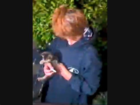 Girl killing kitten. .  ...