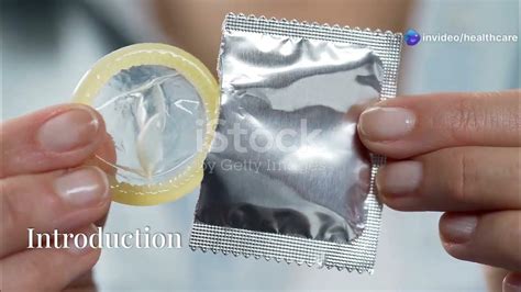 Girl putting condom head.  Cut off bottom of condom.  Inserting a female condom...