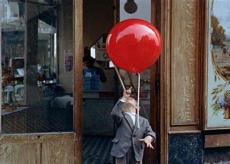 Girl with balloon message.  It can be interpreted as a desire for freedom from...