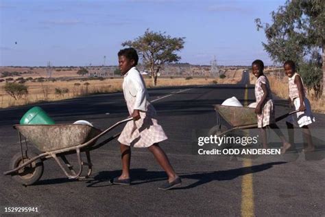 Girls with wheelbarrows.  Browse Getty Images' premium collection of high-quality, authent...