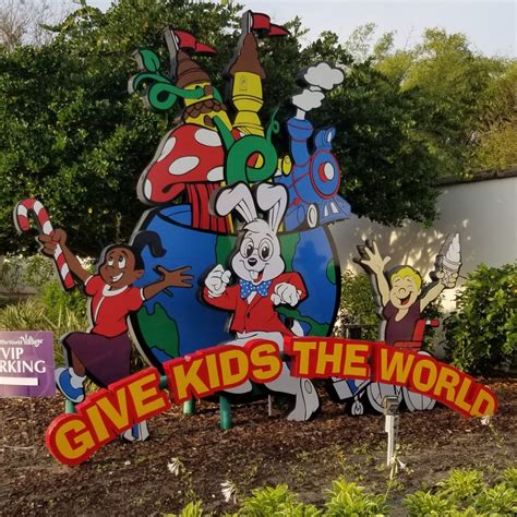 Givekidstheworld village. next to Walmart. Give Kids the World Village/ Kid’s Village is 1 mile south on the right. If the front gate is unattended, press 01 on the keypad to open the gate. Pull up to the first . building inside the gate (there is a covered entrance), and check in. If you have any problems or will be delayed, please call (407) 396-1114. Welcome Home! 