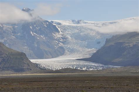 glaciate - cover with ice or snow or a glacier; "the entire area was glaciated" spread over, cover - form a cover over; "The grass covered the grave" 2.. 