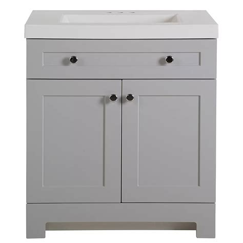 This white freestanding vanity features a full-overlay design with Shaker-style door and drawer profiles, accented by polished chrome pulls. A predrilled white cultured marble vanity top with an integrated rectangular sink completes this vanity set.. 