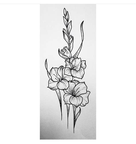 Black and grey marigold tattoo with name. The monochrome 