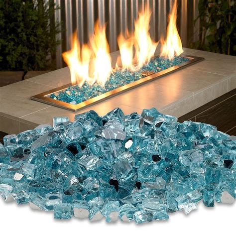 Glass with fire. When you're burning regular fires, clean the glass each week with an ash paste: When the fireplace or woodstove has had a day or two to cool, gather some ashes. Mix the ashes with enough water to make a paste. Apply the paste to the glass with a microfiber cloth to remove soot and dirt. Wipe the glass clean with a damp microfiber cloth. 