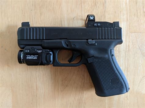 Glock 23 gen 5 mos red dot. G19 Gen5 MOS - Modular Optic System for Gen5. With the G19 Gen5 MOS GLOCK enhances the desirability of the already near-perfect Gen5 model with the addition of the Modular Optic System (MOS). The slide is precision machined to provide a mounting system for popular optic sights. With multiple adapter plates, you can quickly and easily mount ... 