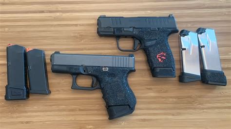 Glock 26 vs hellcat. Though the Glock G43 is a bit longer than the P365 and certainly has less carrying capacity, weight is where the G43 can claw back a small piece of ground. Unloaded, the Glock weighs 17.99 ounces ... 