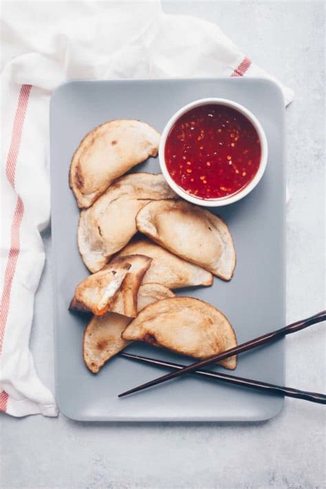 Gluten free crab rangoon. Pour oil in a deep skillet or pan. Heat oil to 350 degrees. Fry each piece for about 1-2 minutes or until lightly golden. Place a wire rack over a layer of paper towels. After they are done frying, place them on the wire rack and allow them to cool. Serve with a sweet and sour sauce. 