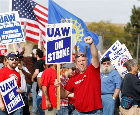 UAW once again expands its historic strike, hitting two of the Big 3 automakers. UAW members strike at GM's Lansing-Delta Assembly Plant in Lansing, Mich., on Sept. 29, 2023. The UAW on Friday .... 