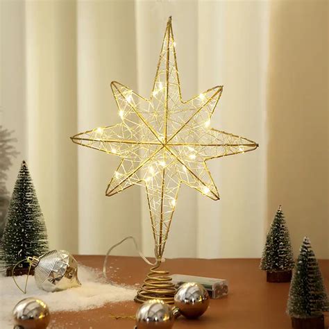 Gold bethlehem star tree topper. .  ...