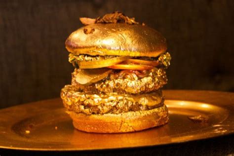Gold burger. So first we got the patty with the sauce followed by a little bit of lettuce, the waggy patty we just made, roasted bell peppers, a good chunk of blue cheese, and kettle fried homemade potato chips. And top it off with the silver bun. If you want to get even fancier, throw in a little bit of silver dust. 