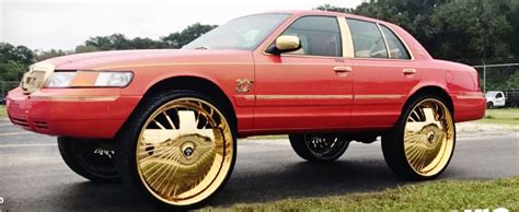 Video of the new school Candy Pagean Gold 2000-2005 Chevrolet Impala lifted high on DUB Fouty spinners, 30's. Car has lambo doors & suicide doors to show off.... 