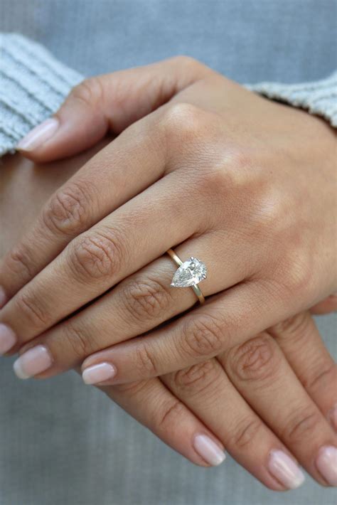 Good engagement ring. Laura Preshong Portia Brilliant Cut Cluster Ring. Buy on Laurapreshong.com $2,650. This asymmetrical cluster ring features mixed sizes of round Canadian diamond side stones that surround a ... 