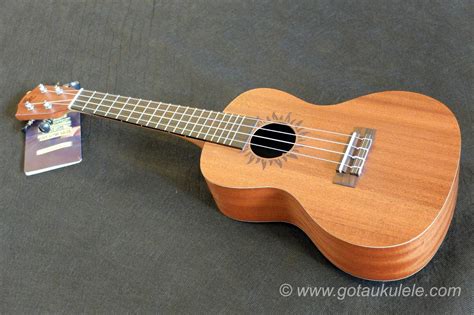 This one uses the more updated bridge (string spacing 43mm) than on the original soprano version that was one piece, and has a removable saddle piece for adjustment, but it is otherwise the same design, made of plastic and slot style for easy string swaps. . Gotaukulele