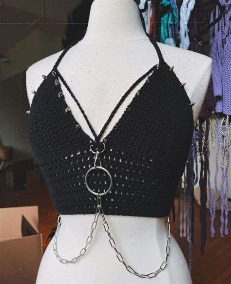 Check out our goth crochet top selection for the very best in unique or custom, handmade pieces from our crop tops shops. 