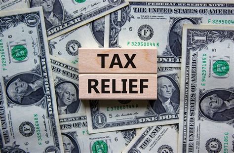 Gov. Healey signs $1 billion tax relief package, reworking tax rebate law, cuts short-term capital gains tax