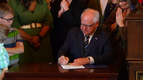Gov. Walz enacts paid family and medical leave plan