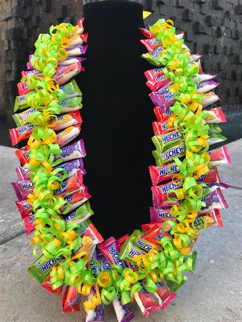 Graduation candy leis ideas. To make a graduation leis out of candy, start by cutting a 4-foot long piece of cellophane that’s about 6 inches wide. Place a small candy bar length-wise on top of the … 