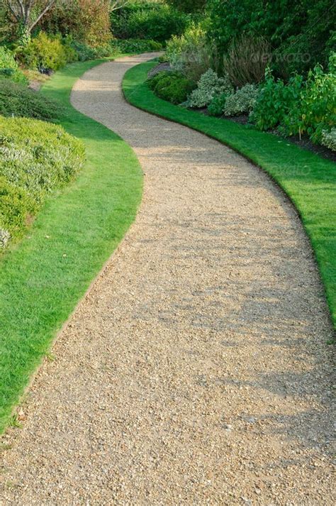 Gravel path. Tamp the soil firm, removing any roots 1/2 inch or more in diameter. Add steps if the walkway must incline more than 10%. If desired, install the weed barrier. Make a screed from a 2x6, notching it equal to … 
