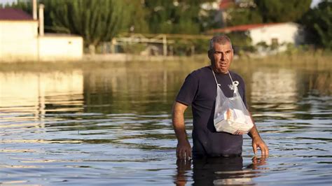 Greek authorities evacuate another village as they try to prevent flooding in a major city