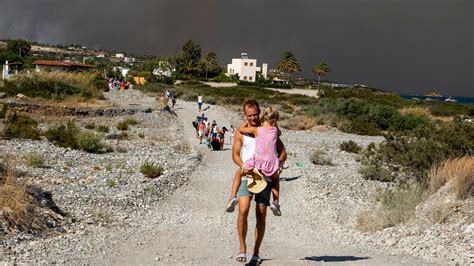 Greek authorities evacuate some 19,000 people as wildfire blazes on the Greek island of Rhodes