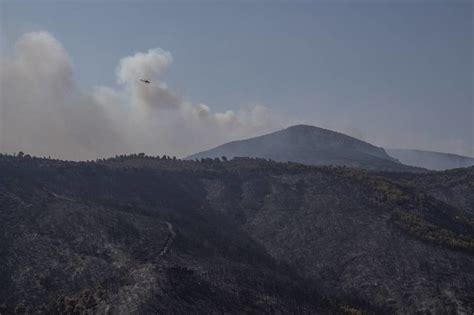 Greek fire officials arrest 2 for arson as multiple wildfires continue to burn across the country