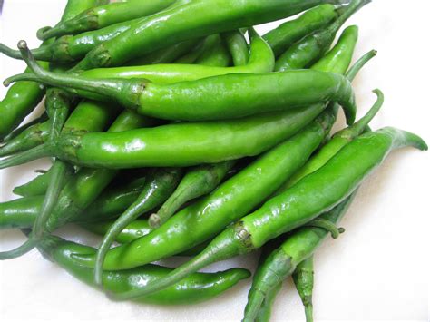 Green chilies. 6. Heart-Healthy. Green chili’s benefits for the heart include reducing the risk of atherosclerosis. Capsaicin acts by lowering blood cholesterol and triglyceride levels. Green chili also increases fibrinolytic activity, responsible for preventing blood clots-the major reason for heart attack or stroke. 