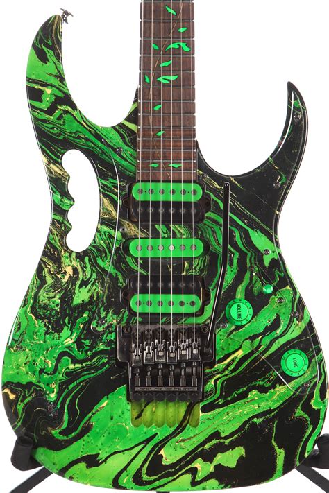 Green guitar. For your consideration is an Ibanez AEWC32FMGSF Acoustic-electric Guitar in Dark Green Sunset Fade. String Type: Steel; Number of Strings: 6 ... 