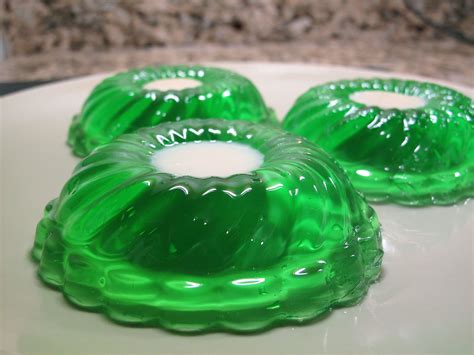Green jello. Add one cup boiling water. Use a spoon to stir the mixtures and disolve the crystals, about 1-2 minutes. Add the cold water, ¼ cup reserved fruit cocktail juice, and drained fruit cocktail. Stir to combine. Place, uncovered, in the refrigerator for 5 hours, stirring after about 3 hours to evenly disperse the fruit. 