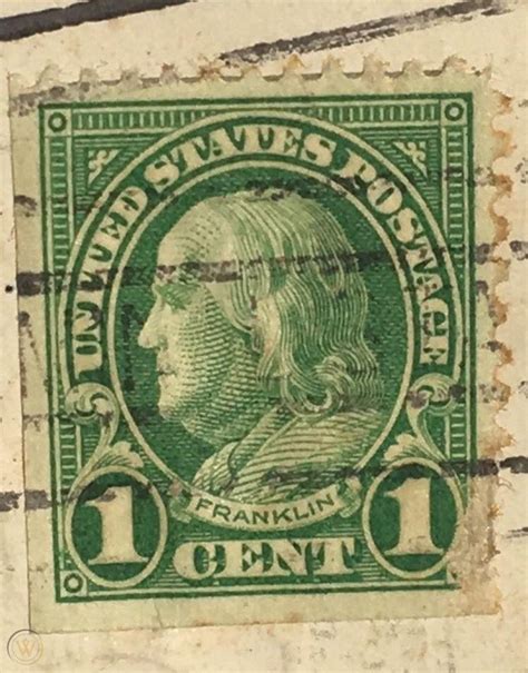 Green one cent benjamin franklin stamp. 