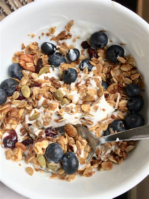 Granola is a food consisting of rolled oats, nuts, seeds, honey or other sweeteners such as brown sugar, and sometimes puffed rice, that is usually baked until crisp, toasted and golden brown. The mixture is stirred while baking to avoid burning and to maintain a loose breakfast cereal consistency. . 