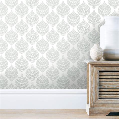 Grey and white peel and stick wallpaper. allen + roth 30.75-sq ft Grey Vinyl Floral Self-adhesive Peel and Stick Wallpaper This shimmering floral trail adds an elegant shine to your walls. Its grey and white color palette will add a ravishing and exquisite look to your décor. 