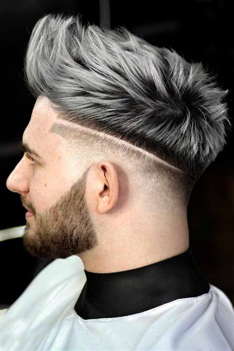 Grey dyed hair for guys. Disconnected Top Crop. This haircut is a blunt, disconnected top crop style. The sides are completely shaved, and the top is left a little longer and textured for an edgy look. The … 