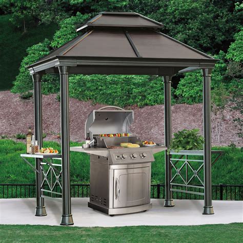 Backyard Discovery. 12.2-ft x 9.5-ft Arcadia Brown Wood Rectangle Gazebo with Steel Roof. Model # 2306073COM. • PRO-TECT™ CERTIFIED: Pro-Tect™ structure; certified withstand a roof load up to 3,510 lbs (up to 18 …. 