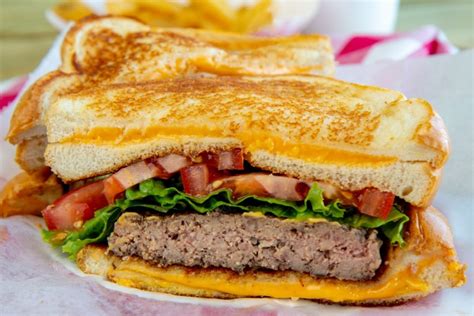 Grilled cheese burger. Preheat a grill to medium high. Form ground beef (preferably chuck) into 6-ounce patties and make an indentation in each. Season the patties on both sides with salt and pepper. 