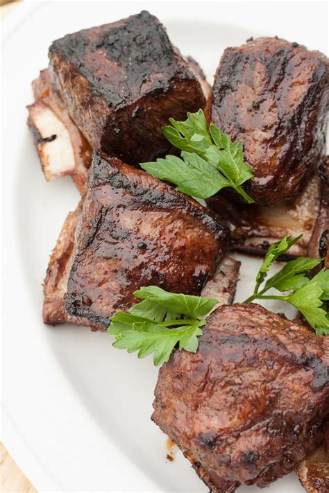 Grilling short ribs. Ingredients. In a medium bowl, mix all of the ingredients except the short ribs, oil, lemon, and slaw. Rub the mixture all over the short ribs and let stand for 20 minutes. Light a grill and oil ... 