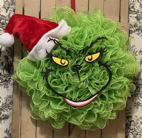 Grinch christmas wreath ideas. 4. Choose Suitable backdrop: Opt for backdrop creations, highlighting the Grinch's solitary dwelling at Mount Crumpit which can add depth to your display. 5. Incorporate Finishing touches: Complete the scene with small details like the Grinch's dog Max, mini candy canes, or a faux snow base to bring Whoville to life. 