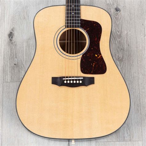 Guild d40.  Using a high-grade solid Sitka spruce The dreadnought-sized D-...