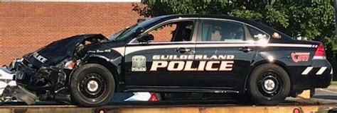 A one-car accident closed part of Western Avenue near Stuyvesant Plaza Sunday, Aug. 3, 2014, in Guilderland, N.Y. The over-turned car came to a rest in front of Christ Lutheran Chruch.