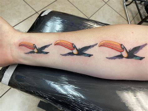 Guinness Toucans by Tim at Showdown Tattoo Parlor, Walnut CA.