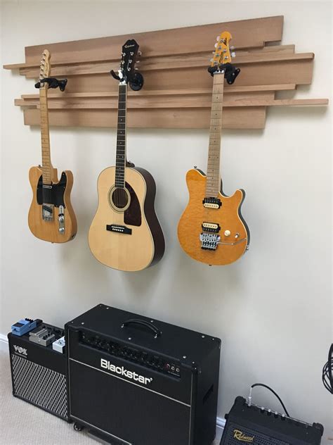 Guitar rack wall. LEKATO Guitar Wall Mount Hanger, Aluminum Guitar Wall Rack Holder with 5 Adjustable Guitar Hangers, Multiple Guitar Holder Stand for Acoustic Electric Guitar Bass Banjo Mandolin. 4.4 out of 5 stars. 118. $75.99 $ 75. 99. $10.00 coupon applied at checkout Save $10.00 with coupon. FREE delivery Mon, Feb 19 . 